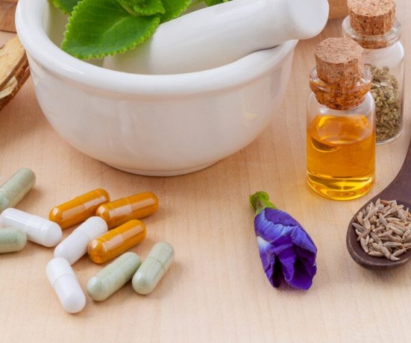 alternative-health-carea-herbal-capsule-with-mortar-wooden-background_35641-2511