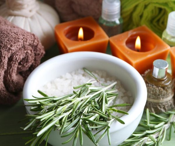 branches-rosemary-sea-salt-bowl-towels-candles-bottle-with-massage-oil-wooden-background-rosemary-spa-concept_392895-112122